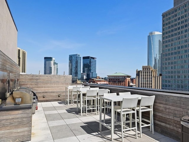 45 Temple St Unit 410, Boston, MA 02114 - view of patio with a city view, area for grilling, and an outdoor bar