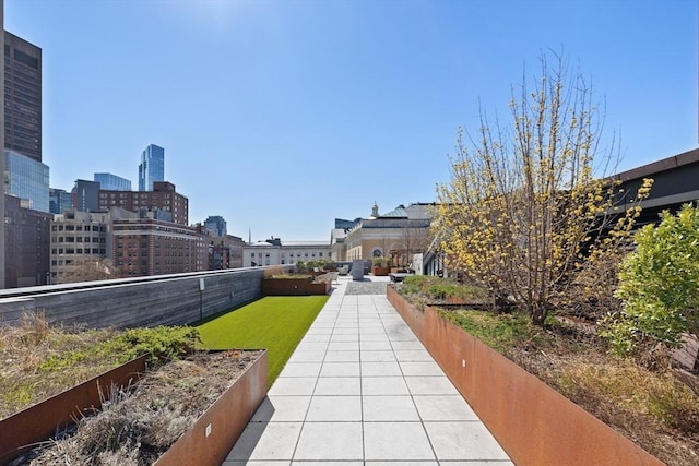 45 Temple St Unit 410, Boston, MA 02114 - surrounding community featuring a lawn, a view of city, fence, and a patio