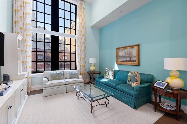 45 Temple St Unit 410, Boston, MA 02114 - living area featuring baseboards, a high ceiling, and wood finished floors