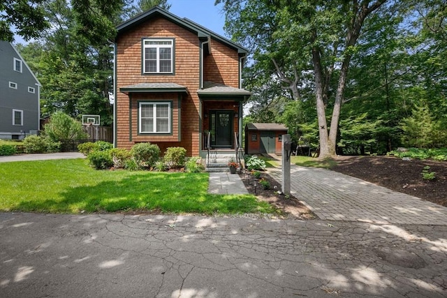 106 Edgemoor Ave, Wellesley, MA 02482 - view of front facade featuring a front lawn and decorative driveway