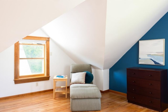 134 Brown St, Waltham, MA 02453 - living area with wood finished floors, lofted ceiling, and baseboards