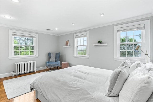 4 Worthen Rd, Winchester, MA 01890 - bedroom featuring radiator, wood finished floors, ornamental molding, and recessed lighting