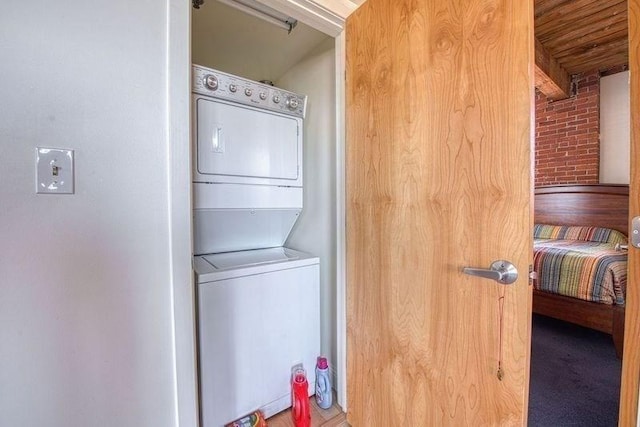 147 Centre St Unit 201, Brockton, MA 02302 - washroom featuring stacked washer and clothes dryer and brick wall