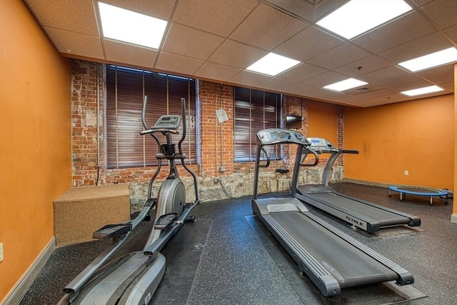 147 Centre St Unit 201, Brockton, MA 02302 - workout area with a paneled ceiling, baseboards, and brick wall