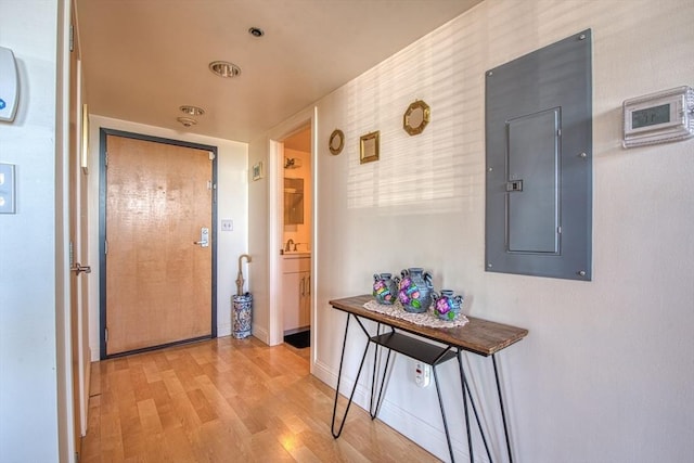 147 Centre St Unit 201, Brockton, MA 02302 - hallway featuring electric panel, light wood-style flooring, and baseboards