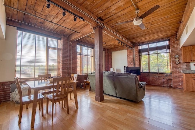 147 Centre St Unit 201, Brockton, MA 02302 - dining space with rail lighting, brick wall, wooden ceiling with exposed beams, light wood-style floors, and a ceiling fan