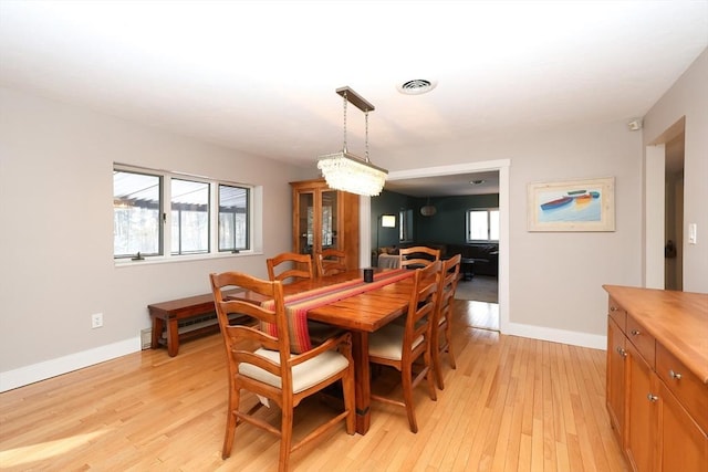 dining space featuring light hardwood / wood-style floors