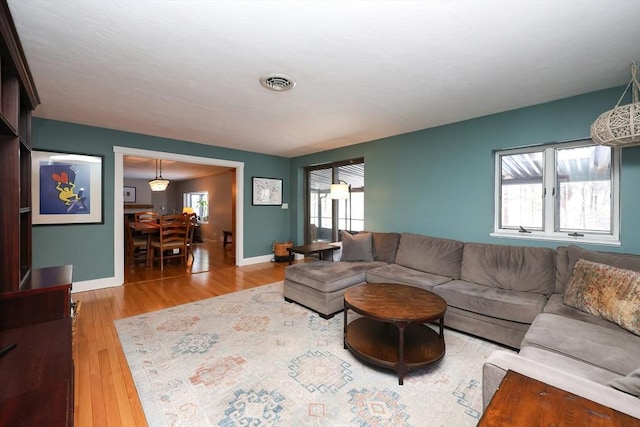 living room with light hardwood / wood-style flooring