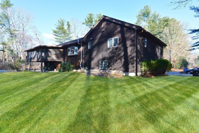 back of house with a yard and a sunroom