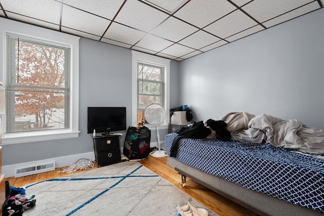 bedroom with hardwood / wood-style floors