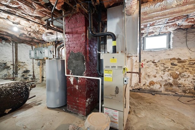 utility room featuring electric panel and gas water heater