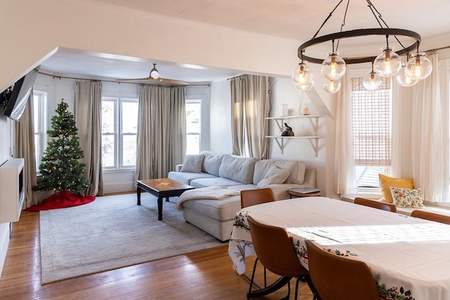 living room with wood-type flooring and ornamental molding