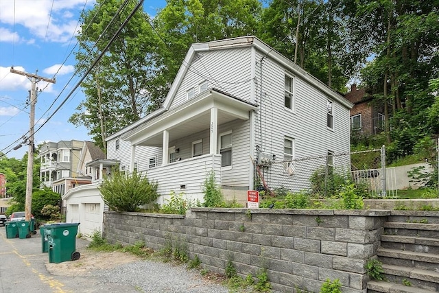 205-207 High St, Fitchburg, MA 01420 - view of side of home featuring asphalt driveway and an attached garage