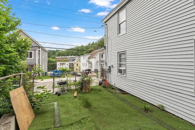 205-207 High St, Fitchburg, MA 01420 - view of yard with cooling unit and a residential view
