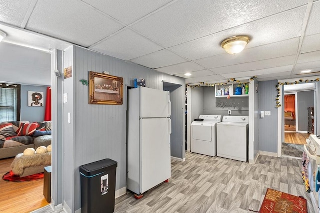 205-207 High St, Fitchburg, MA 01420 - washroom with light wood finished floors and independent washer and dryer