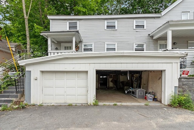 205-207 High St, Fitchburg, MA 01420 - view of front of home featuring a garage and driveway