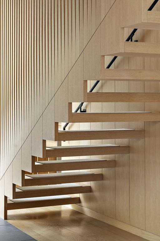 stairway featuring wood finished floors