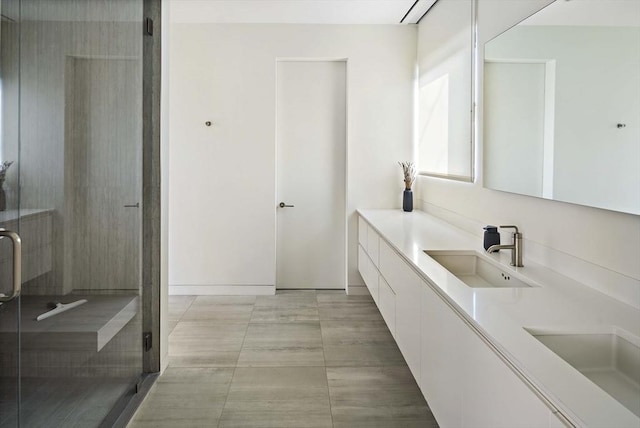 full bath with a stall shower and vanity