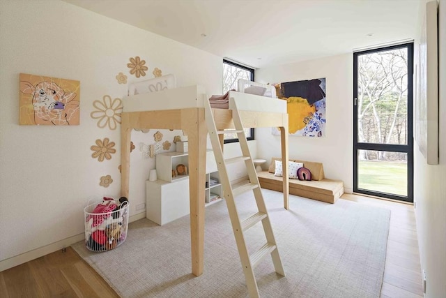 bedroom with wood finished floors