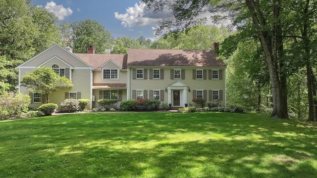 171 Brentwood Cir, North Andover, MA 01845 - view of front of home with a chimney and a front yard