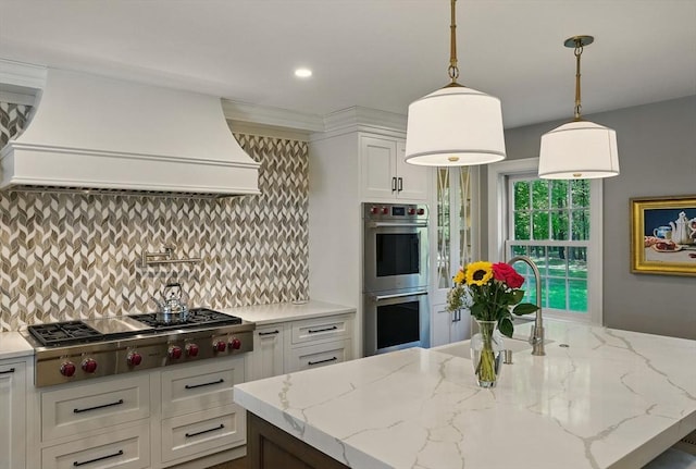 171 Brentwood Cir, North Andover, MA 01845 - kitchen featuring stainless steel appliances, custom range hood, tasteful backsplash, white cabinets, and recessed lighting
