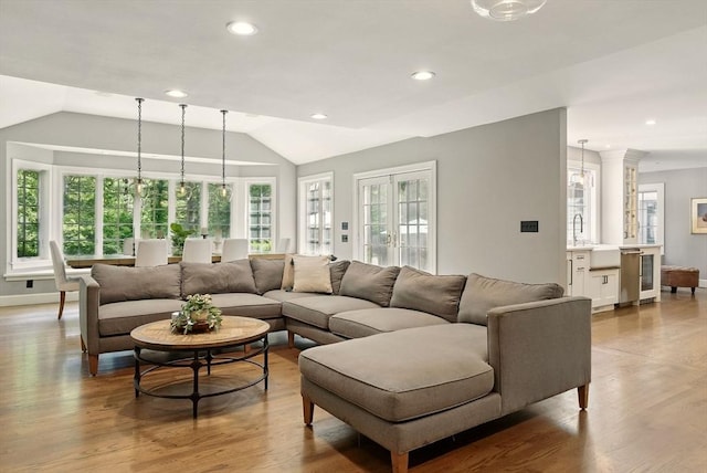 171 Brentwood Cir, North Andover, MA 01845 - living room with wine cooler, lofted ceiling, wood finished floors, recessed lighting, and baseboards
