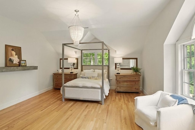 171 Brentwood Cir, North Andover, MA 01845 - bedroom featuring lofted ceiling, wood finished floors, a chandelier, and baseboards