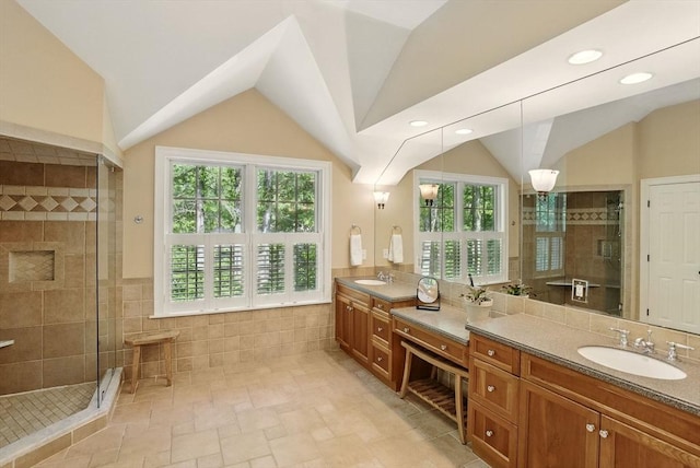171 Brentwood Cir, North Andover, MA 01845 - full bathroom featuring vaulted ceiling, vanity, a shower stall, tile walls, and recessed lighting