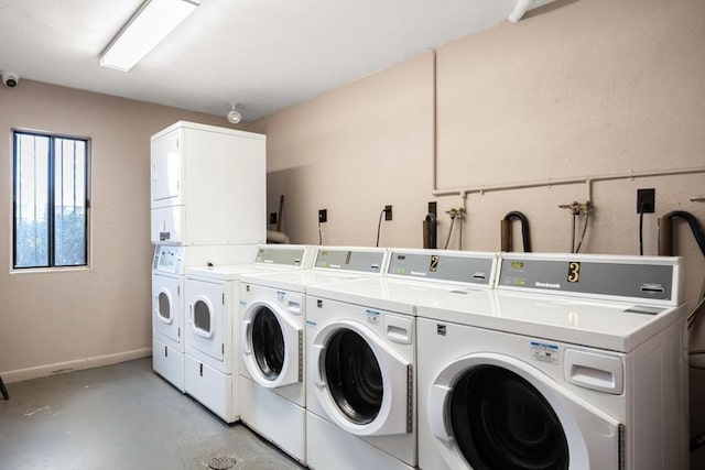 laundry room with stacked washing maching and dryer and washer and dryer