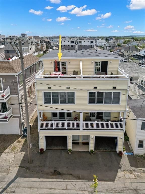 16 Ocean St Unit A, Salisbury, MA 01952 - view of front of home featuring a residential view, an attached garage, and a balcony