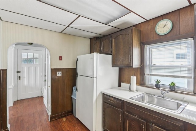 45 Franklin Ave, Quincy, MA 02170 - kitchen featuring freestanding refrigerator, dark wood finished floors, a sink, a wainscoted wall, and light countertops