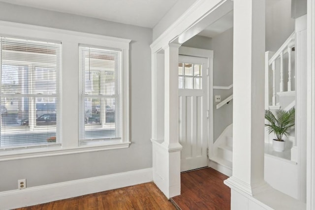45 Franklin Ave, Quincy, MA 02170 - foyer with stairway, baseboards, ornate columns, and dark wood-style floors