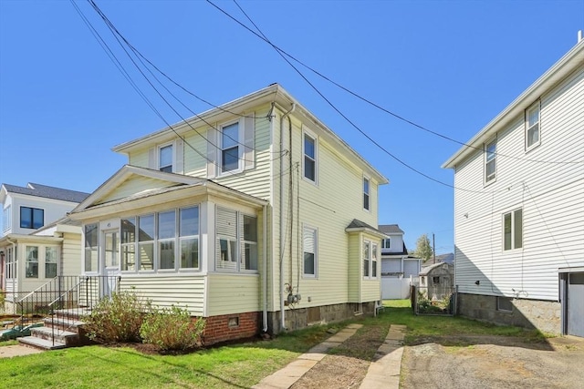 45 Franklin Ave, Quincy, MA 02170 - rear view of property featuring a lawn