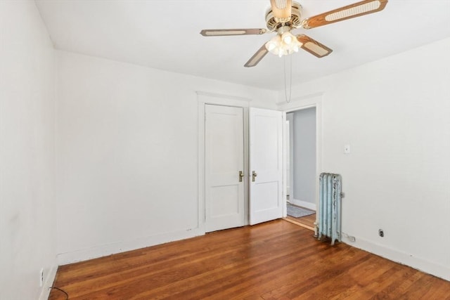 45 Franklin Ave, Quincy, MA 02170 - empty room featuring baseboards, wood finished floors, a ceiling fan, and radiator heating unit