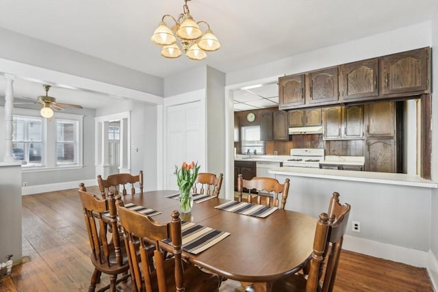 45 Franklin Ave, Quincy, MA 02170 - dining space with baseboards, a wealth of natural light, dark wood finished floors, and ceiling fan with notable chandelier