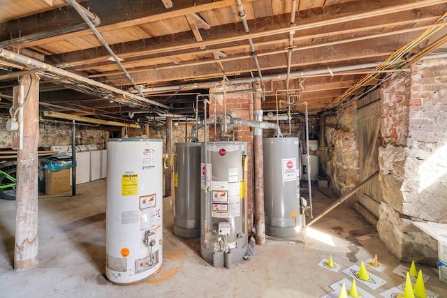 utility room featuring washer and clothes dryer and water heater