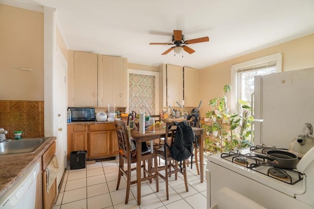 kitchen featuring sink, white appliances, ceiling fan, and light tile patterned flooring