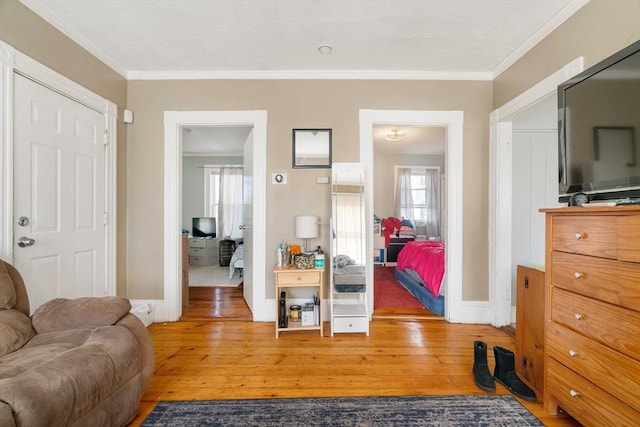 interior space featuring ornamental molding and hardwood / wood-style floors