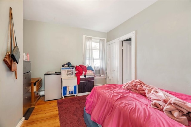 bedroom with light hardwood / wood-style floors