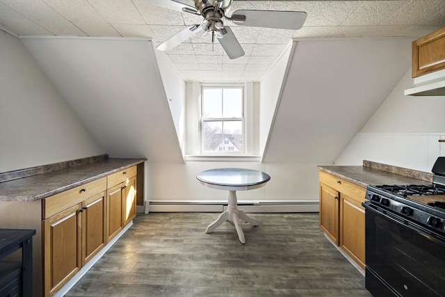 kitchen featuring ceiling fan, dark wood-type flooring, black range with gas stovetop, and baseboard heating