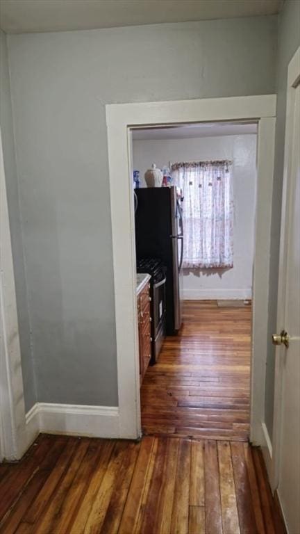 hallway with dark wood-type flooring