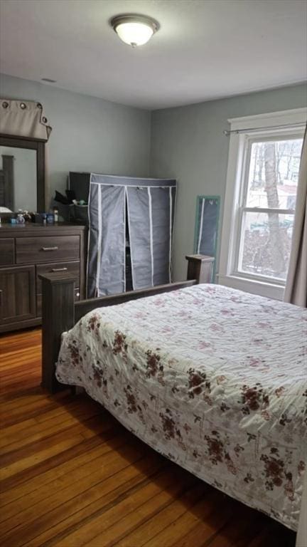 bedroom with hardwood / wood-style flooring