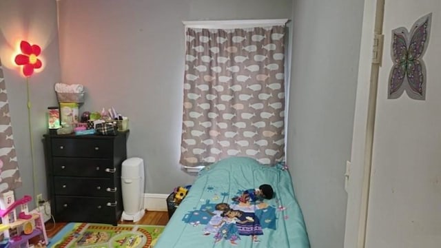 bedroom featuring hardwood / wood-style flooring