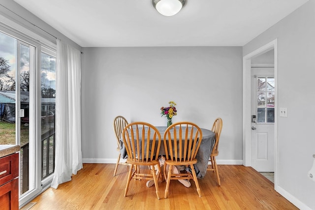 dining area with light wood-type flooring