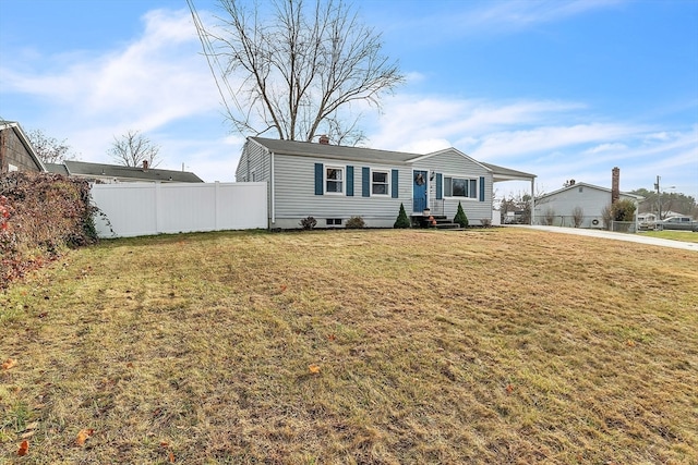 view of front facade featuring a front yard and a carport