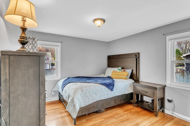 bedroom with hardwood / wood-style floors