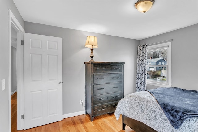 bedroom with hardwood / wood-style flooring