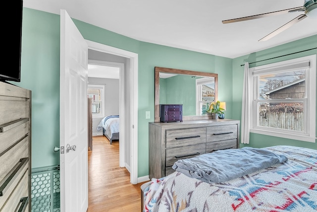 bedroom featuring ceiling fan and light wood-type flooring