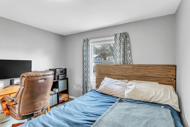 bedroom with wood-type flooring