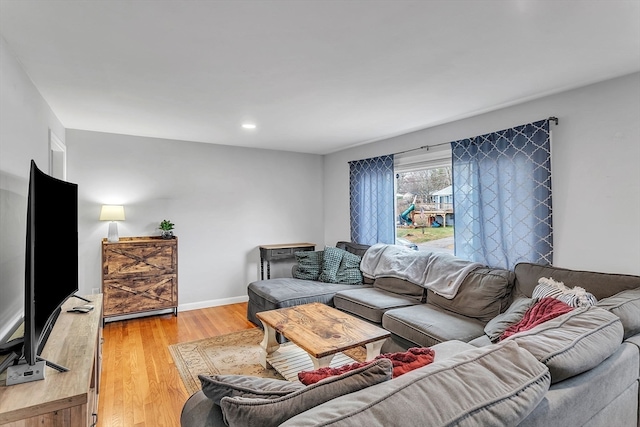 living room with light hardwood / wood-style flooring